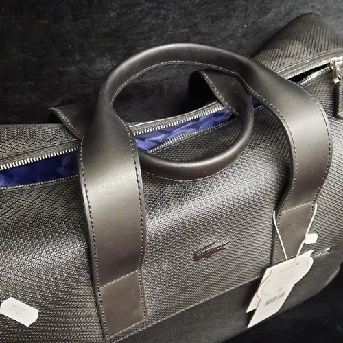 270 - A super stylish gentleman's Lacoste black cow leather weekend travel bag. Brand new with tags. RRP €... 