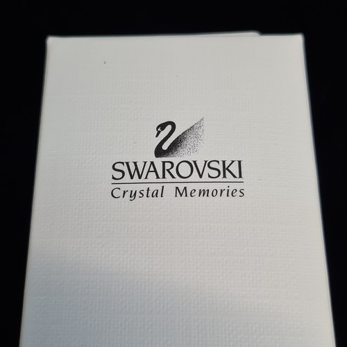 143 - Two Swarovski Crystal Memories from the retired line. Lot includes a statuette of a sewing machine a... 