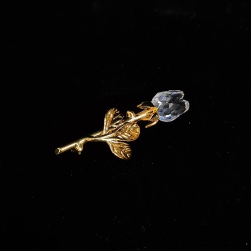 143 - Two Swarovski Crystal Memories from the retired line. Lot includes a statuette of a sewing machine a... 