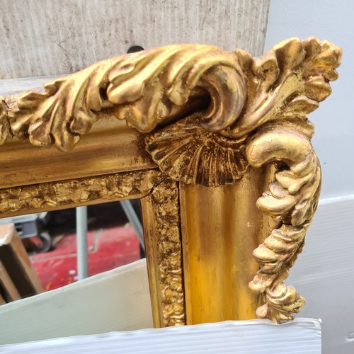 389 - Star Lot : A lovely large Antique gilt horizontal mirror with scroll , shell and foliate motifs. Dim... 