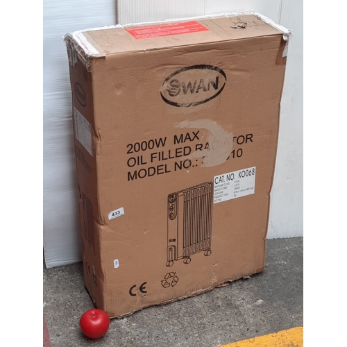 A new Swan 2000W maximum oil-filled radiator, white, model SH1010, boxed, on castors; carton printed with product outline and specification label.