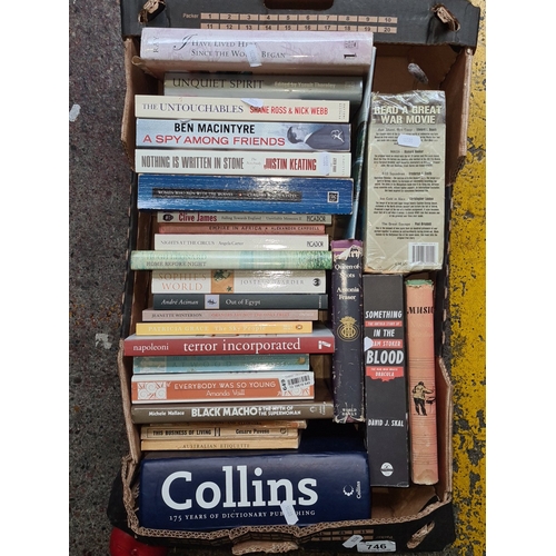 A group of assorted paperback and hardback books, including a large ...