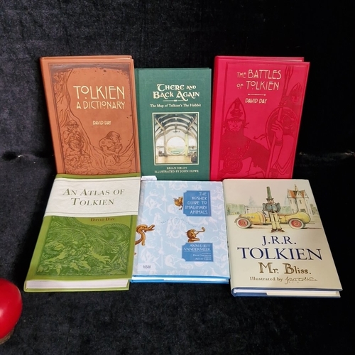 A group of illustrated hardback reference and companion volumes ...
