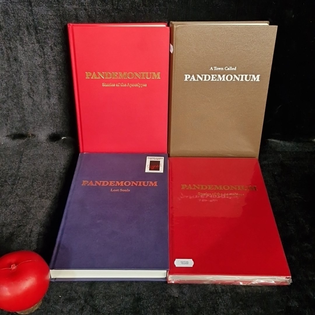 A group of hardback books titled 