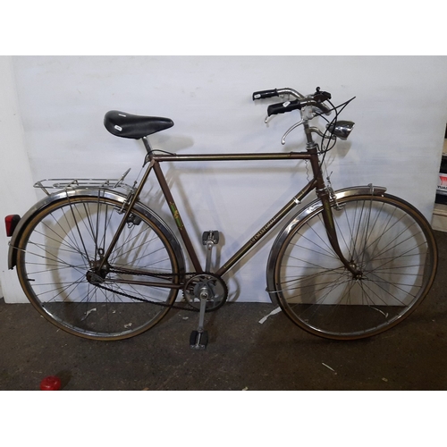 Star Lot : A Peugeot men’s road bicycle, steel frame with upright handlebars and brake levers, chrome mudguards, rear luggage rack, dynamo headlamp, and cottered chainset, with Peugeot transfers to the frame.

Previous in auction on T120226  - 15/02/2026 with Lot no.968

Previous in auction on T190226  - 22/02/2026 with Lot no.1436

Previous in auction on T022626  - 01/03/2026 with Lot no.1449