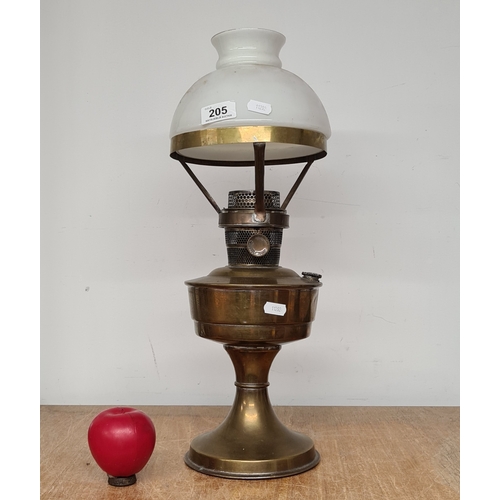 A fabulous antique Victorian brass oil lamp with a milk glass shade.