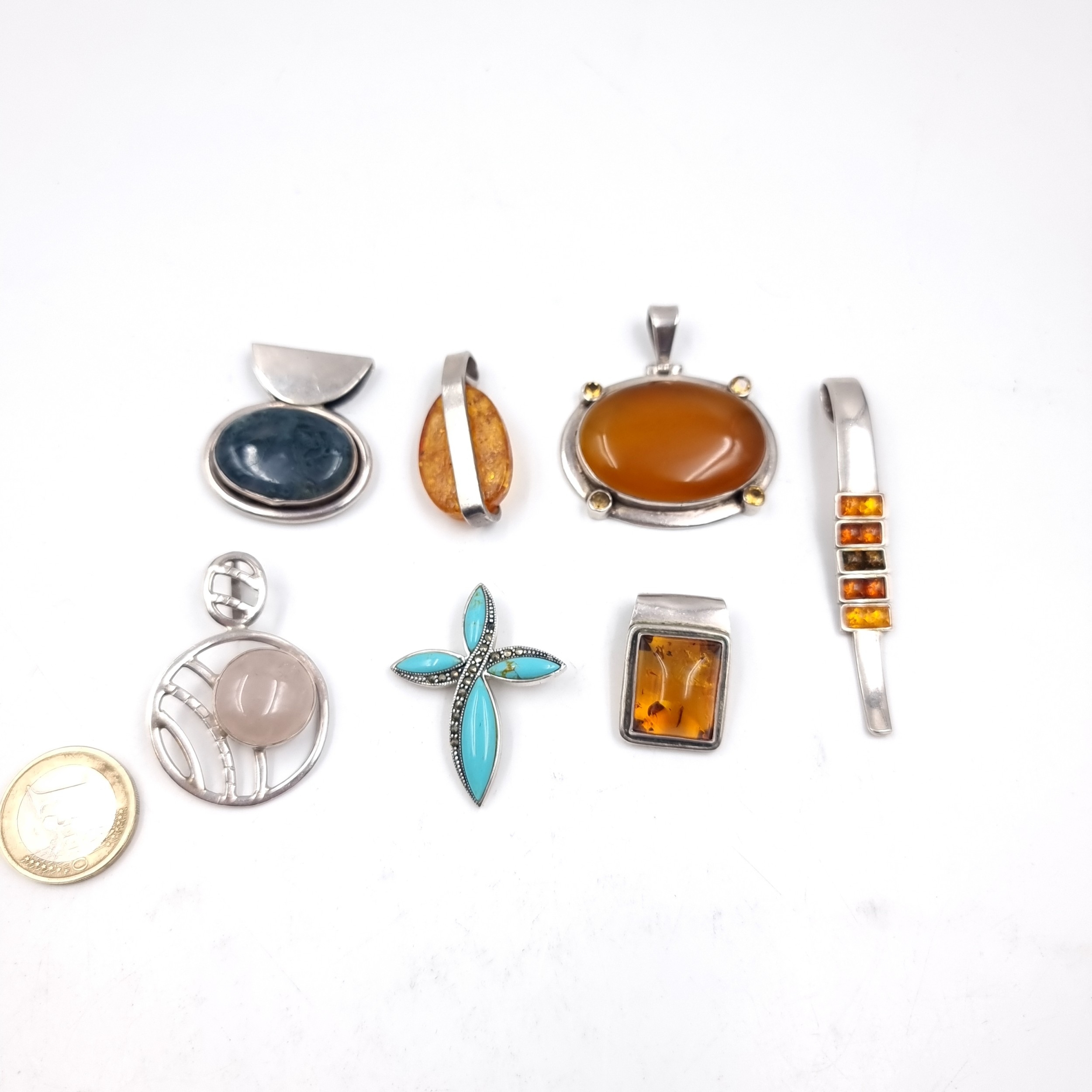 Seven assorted gem set pendants including five sterling silver mounted ...