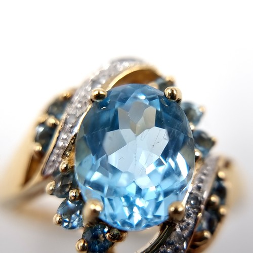 Star Lot: A fabulous twist mount Diamond and Topaz ring set in nine ...