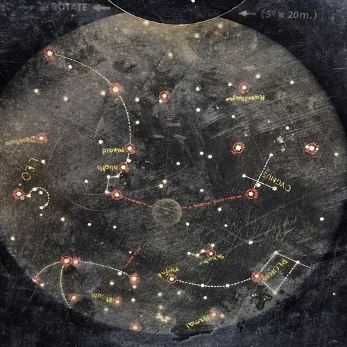 A vintage astronomical planisphere, specifically a 