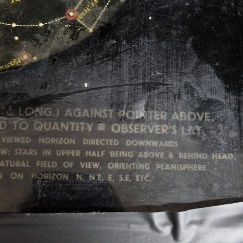A vintage astronomical planisphere, specifically a 