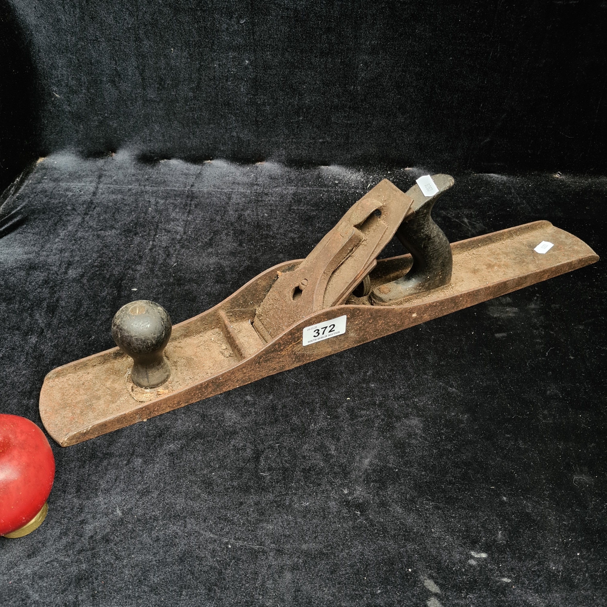 A large antique cast metal wood working plane.
