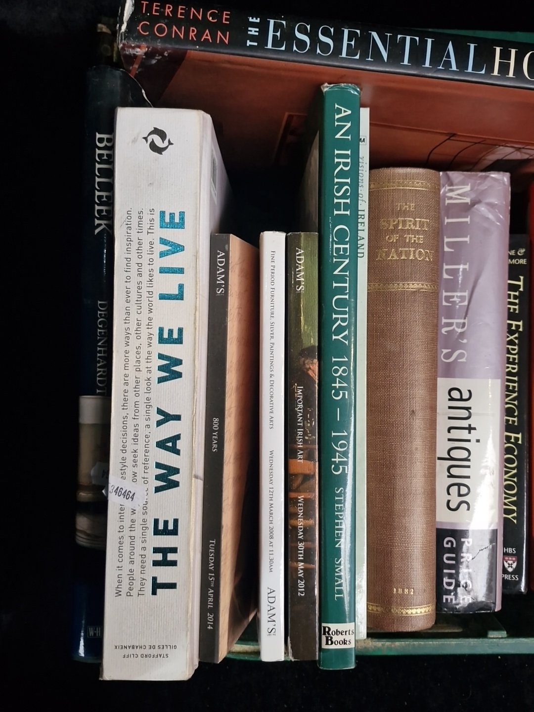 A group of assorted hardback and paperback books, including antiques ...