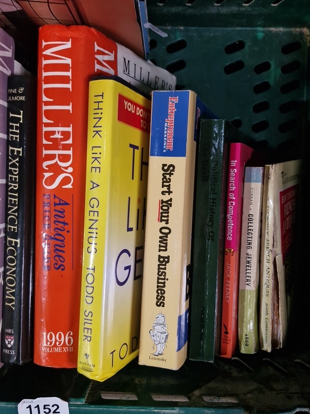 A group of assorted hardback and paperback books, including antiques ...
