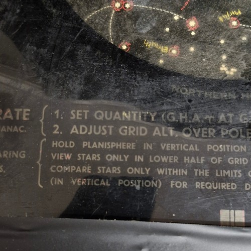 A vintage astronomical planisphere, specifically a 