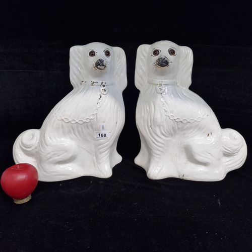 A good pair of vintage ceramic Staffordshire wally dogs with glass eyes and firing holes to backs and bases. Both in good condition. Please note, the image staged in an interior space was created by a new imaging/ staging software called showiton.ai. Upload a simple image of a piece of furniture and the software stages it for you. Paste the URL (showiton.ai) into your browser and try it for free. It’s a very simple, user-friendly platform.