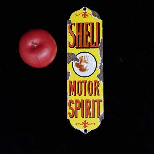 An enamelled and printed finger plate reading 'Shell Motor Spirit'.