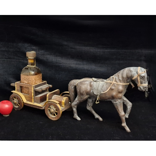 124 - A vintage collectible figure of a horse and  a wooden carr, which serves as a display for a bottle. ... 