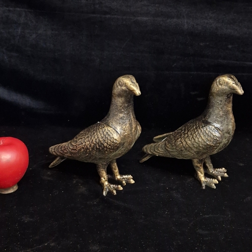 126 - Two cast iron bird sculptures with patinated bronzed finish. Would make for lovely accent pieces for... 