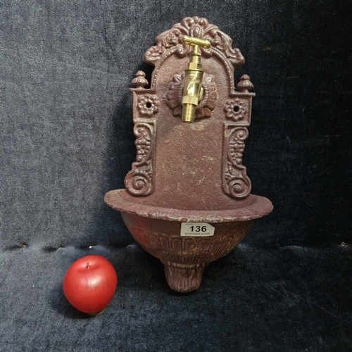 136 - A decorative cast iron Art Nouveau atyle water fountain. Holds brass tap.