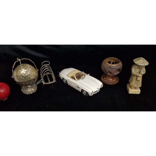 138 - A mixed collection of items including a Burago die cast model of a Mercedes Benz 300 SL, A Silverpla... 