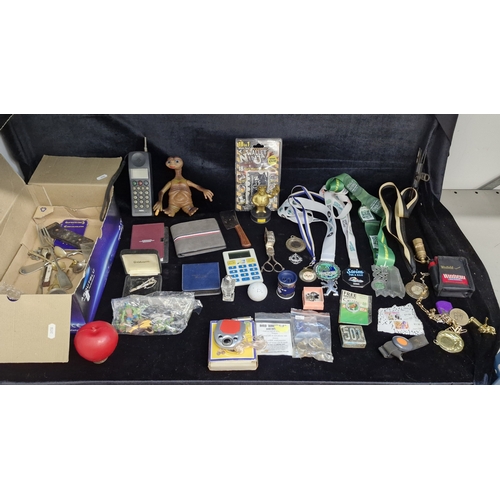 155 - A box of vintage sundries including Avonmore summer groove fm radio with earphones, E.T. figure, The... 