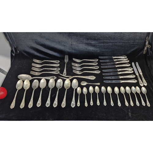 177 - A box of assorted vintage king pattern silverplate cutlery including knives, forks and spoons.