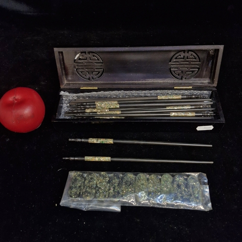 179 - A nice lot of Vietnamese chopsticks and chopstick rests featuring Mother of Pearl accents. Housed in... 