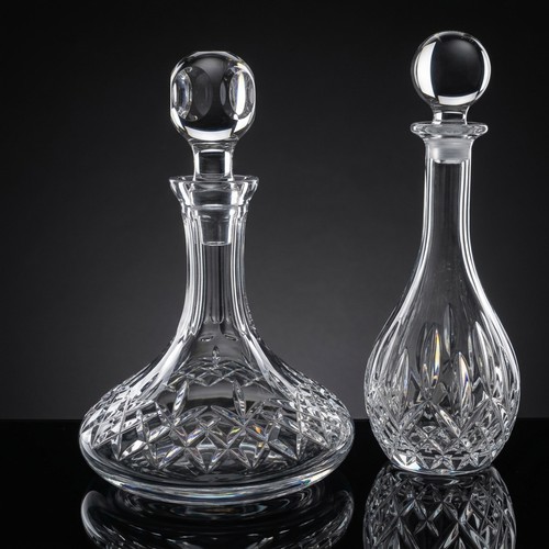 162 - Two quality cut crystal decanters including a ships decanter, and further example. Both in good cond... 