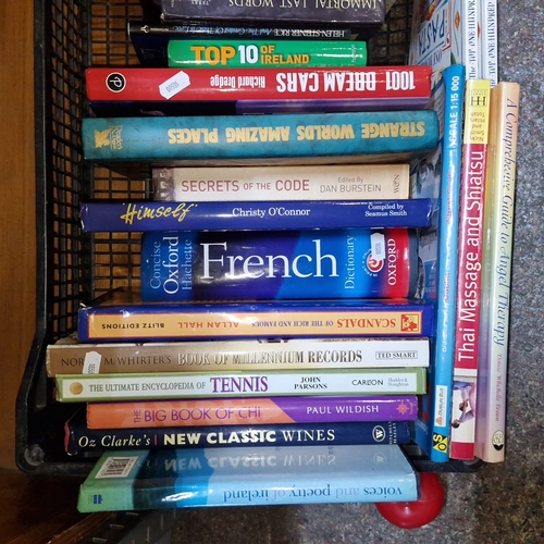 A crate of assorted hardback and paperback books, including reference ...