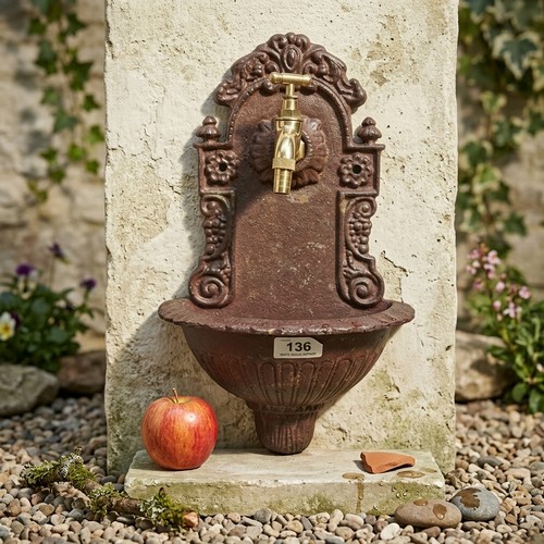 136 - A decorative cast iron Art Nouveau atyle water fountain. Holds brass tap.