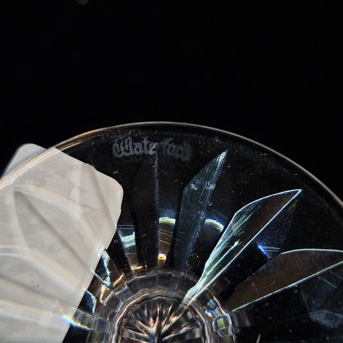 122 - Four Waterford Crystal pieces including a Whiskey water jug in the Lismore pattern and three glasses... 