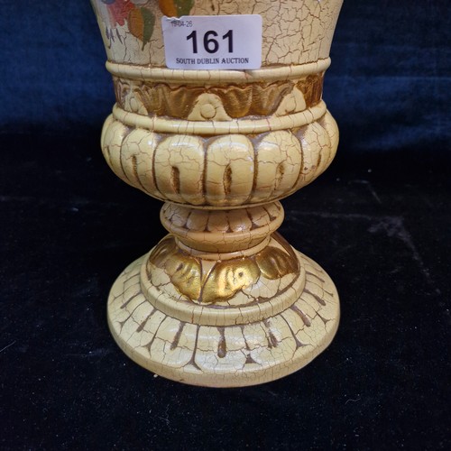 161 - A large decorative ceramic vase with a lid featuring a distinct cream-coloured crackle glaze, gilded... 