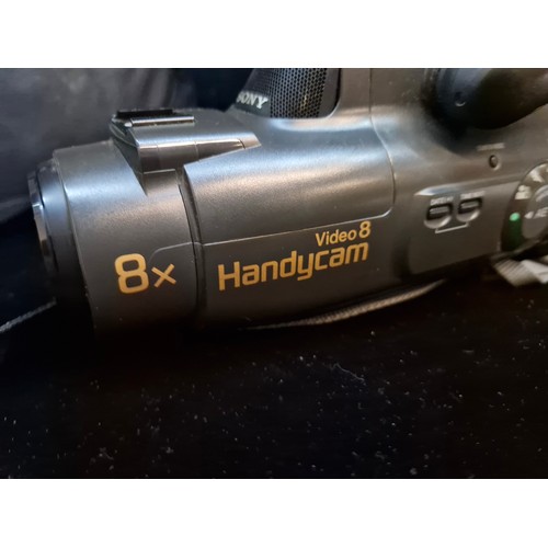 174 - A vintage Sony Video 8 HandYcam video camera recorder CCD-FX200E with cables and travel bag.