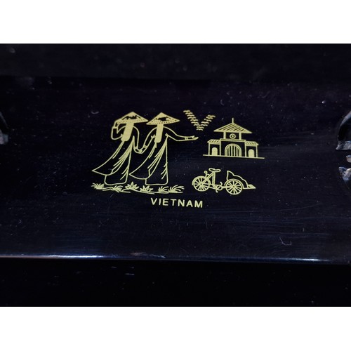 179 - A nice lot of Vietnamese chopsticks and chopstick rests featuring Mother of Pearl accents. Housed in... 