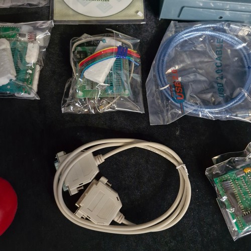 A box of electronic components and microcontroller programming ...