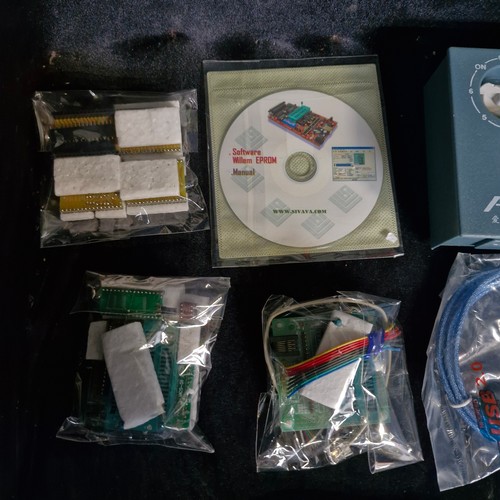 A box of electronic components and microcontroller programming ...