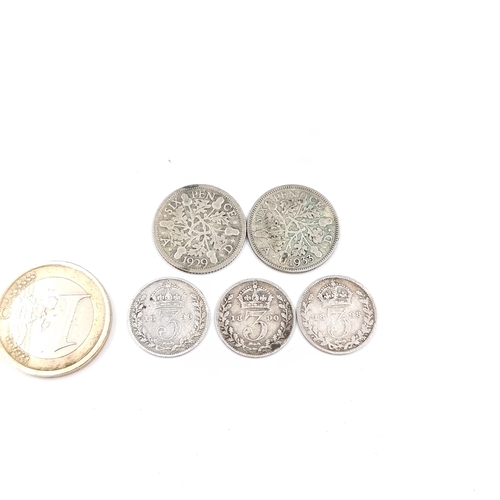 560 - A collection of five UK coinage Victoria three pence pieces. Together with two Edward V six pence pi... 