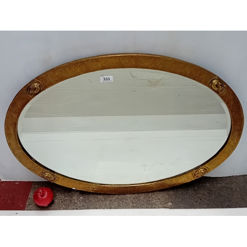 1289 - Star Lot : A wonderful antique Arts & Crafts movement oval wall mirror, likely dating from around 19... 