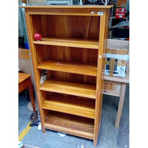 Contemporary hardwood open bookcase, the rectangular moulded top above an arrangement of fixed shelves within plain uprights, raised on square-section legs; the warm-toned timber showing varied figuring throughout.

Previous in auction on T230426  - 26/04/2026 with Lot no.666