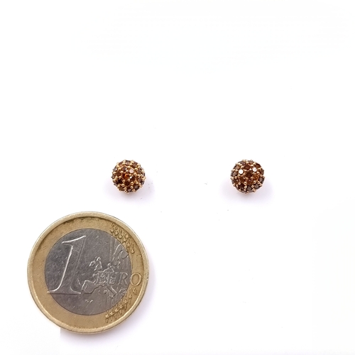 1 - Star Lot: A most beautiful pair of Champagen Diamond stud earrings set in nine carat gold. Weight - ... 