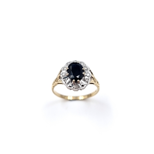 12 - Star Lot: A fabulous large vintage Sapphire and Diamond ring set in nine carat gold. Size - O 1/2, W... 