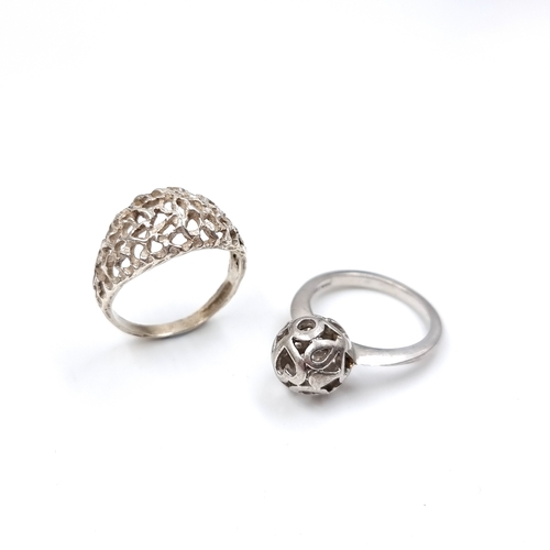 24 - Two Sterling Silver rings of bomb and ball design. Sizes - n 1/2 & P, Total weight - 7 grams. Please... 