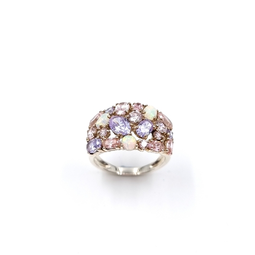 27 - A large and vibrant stament cocktail ring set in Sterling Silver.  Set with Tanzanite, Opal and Tour... 