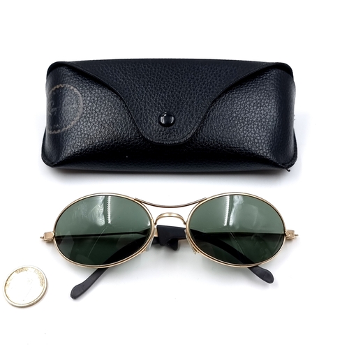29 - A pair of Ray Ban metal framed sunglasses. With lens in good clean condition. Comes in original Ray ... 