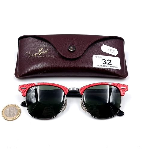 32 - A pair of Ray Ban red tinted framed sunglasses. Lens in good clean condition.  Comes in original Ray... 