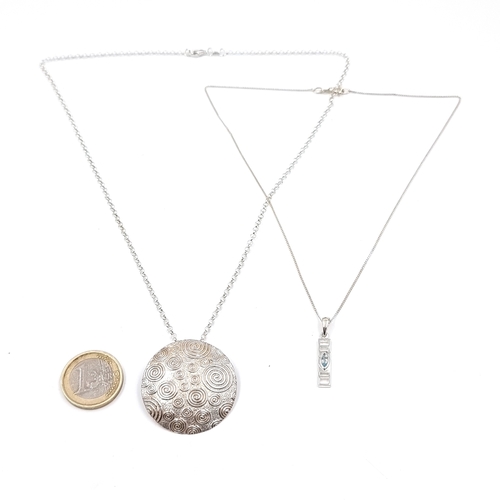 36 - A Sterling Silver Swirl designed pendant necklace and chain. Together with a further Sterling Silver... 
