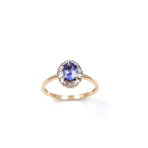 4 - Super Star Lot: A gorgeous Tanzanite ring set in nine carat gold with Baguette cut diamond halo. Siz... 