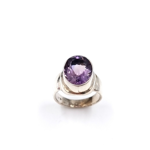 43 - A large Amethyst statement ring set in Sterling Silver. Size - P, Weight - 8.8 grams. Please note, t... 
