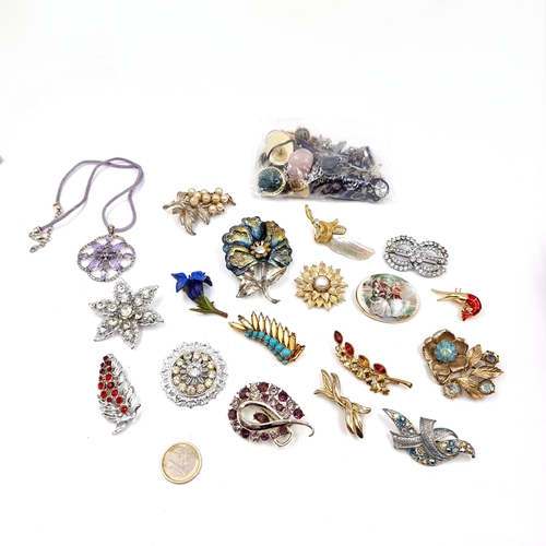51 - A large collection of earrings and brooches. Total weight - 405 grams.