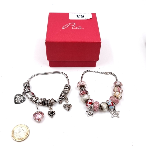 53 - Two Sterling Silver bracelets set with Pandora style charms. Total weight - 80 grams. Please note, t... 